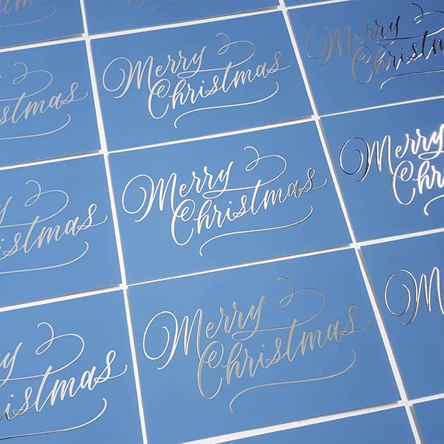 Blue Merry Chrismas cards with silver foil by EP Lettering printed by MOO 